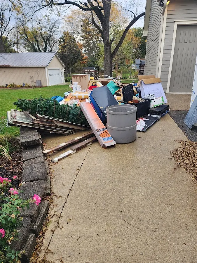 Dumpster being loaded with debris for Estate Cleanout Dumpster Rental in Brockton